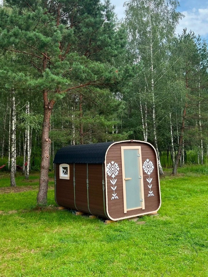 Our cabin with white ornaments on the front