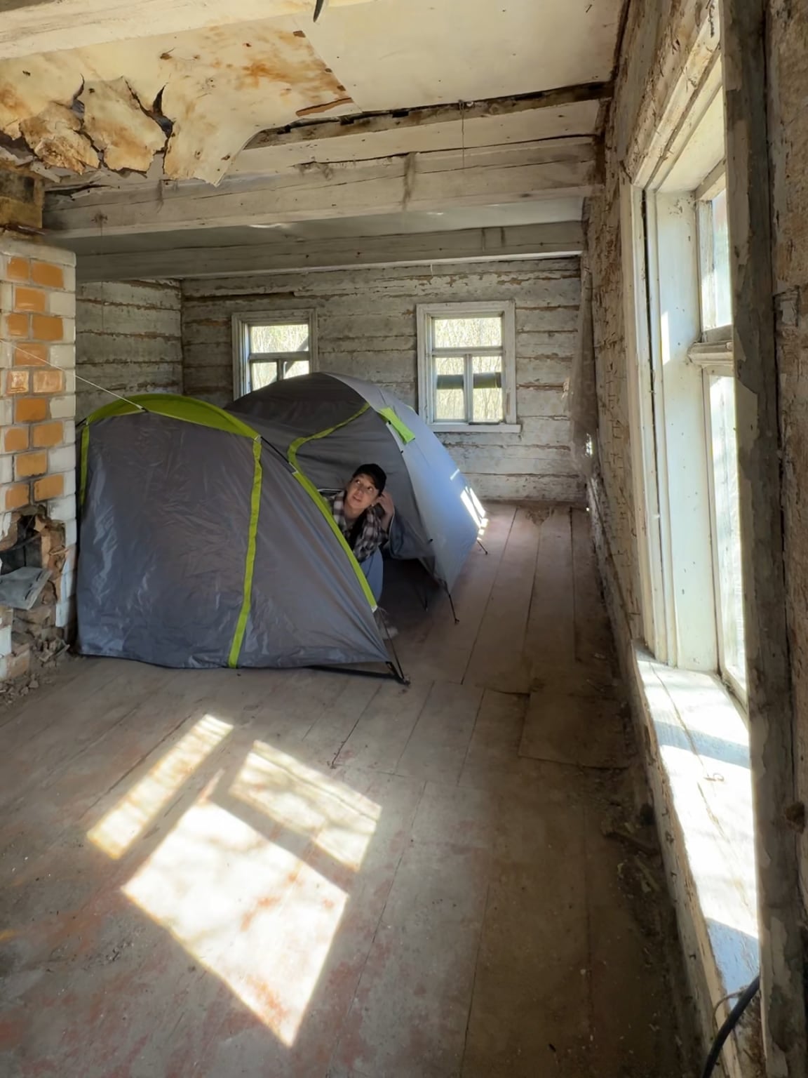 A tent inside the old farmhouse